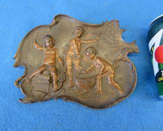 Lot 93. Cast tray or wall hanging depicting cherubs at play