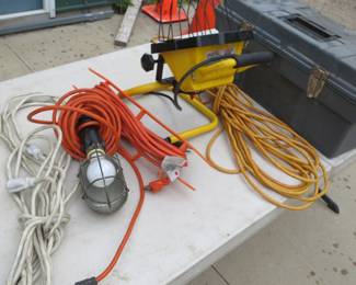 Lot 31. Shop light, trouble light, cords and box