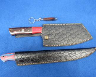 Lot 331. Three new Damascus knives, two with leather sheaths, and one keychain/pocket-knife, and no maker's mark