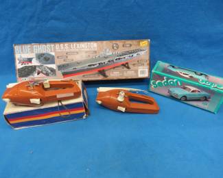 Lot 219. Two Popeil's Pocket Fishermen, USS Lexington model open box, and a friction car