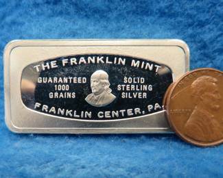 Lot 359. Franklin Mint Bank-marked sterling silver ingot. 65.32 grams