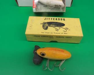 Lot 45. Arbogast Jitterbug in a box with papers, and a Heddon Baby Lucky 13 in a box with papers