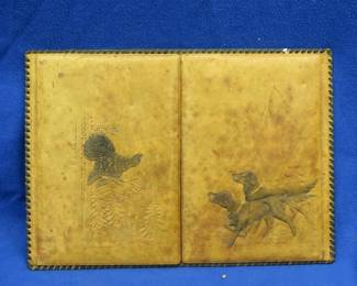 Lot 196. Hand-tooled leather folding item with inserts, we are thinking maybe a menu holder/placemat