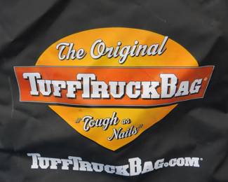 Lot 340. TuffTruckBag. Truck bed cargo bag. 48"L x 22"H x 39"W. Includes bungees. Excellent condition.
