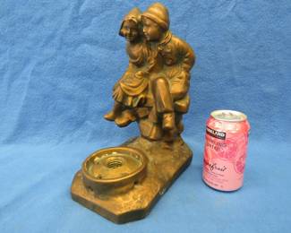 Lot 405. Cast metal lamp base with Dutch boy and girl