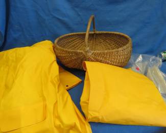 Lot 251. Size L rainsuit, pants NIP, and a woven basket