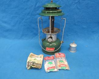 Lot 278. 1970 double-mantle Coleman 220F lantern. Includes mantles, manual, and funnel. No globe.