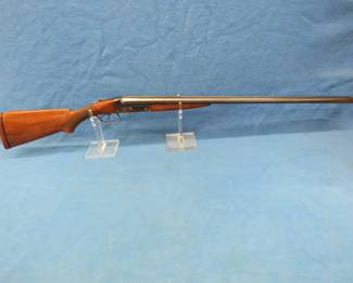 Lot 14. 1930 Winchester Model 21 side by side 12-gauge shotgun. Ser. No. 2493. 30" barrel.Very good overall condition showing light wear.