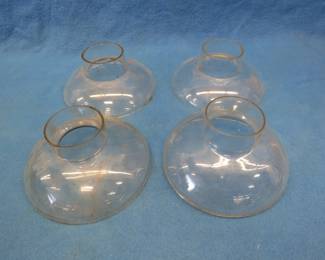 Lot 445. Four vintage clear glass illuminator shade bases for kerosene oil lamps with 3-inch fitter. Two are marked REIS with a patent date of 1882.