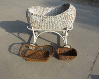 Lot 157. Rolling wicker bassinet and two vintage baskets