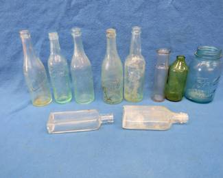 Lot 389. Old bottles recovered from a Minnesota lake. Includes Hamm's, Schmidt, Gluek and more.