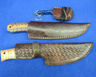 Lot 330. Three new knives with leather sheaths, one is a Damascus neck-knife, no maker's mark