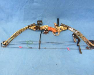 Lot 25. RH PSE Fire-Flight compound bow. 29" draw. 60 lb. pull with a 75% let-off. Includes 2 releases, 4 carbon arrows in a quiver, sling, and a cloth case.