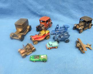 Lot 26. Midcentury toy cars, red metal touring car, made in Japan; metal airplane, and more.