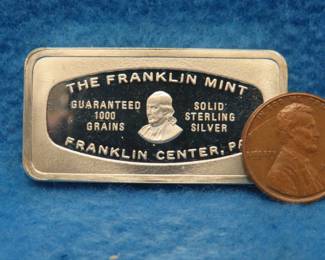 Lot 362. Franklin Mint Bank-marked sterling silver ingot. 65.87 grams