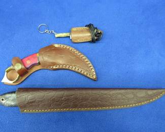 Lot 333. Three new Damascus knives with leather sheaths and no maker's mark