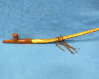 Lot 345. Peace pipe with repairs. Unknown origin or composition.