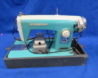 Lot 488. Vintage Brother sewing machine, powers on but needs a new belt and some adjustment