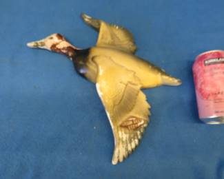 Lot 322. Vintage Grain Belt plaster advertising piece of a canvasback duck. Designed to hang on the wall. Approx. 12" X 12".