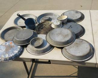 Lot 269. Tin plates and cups