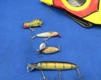 Lot 486. Heddon Vamp Spook, an Arbogast Jitterbug, two beachballs, and more