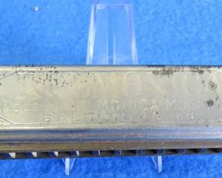 Lot 106. Rolmonica 12-hole diatonic harmonica. Embossed Made in Germany and made in Baltimore.