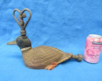 Lot 372. Antique cast-iron mallard lawn sprinkler. Crack in the sprinkler head which would not affect the watering function. No maker's mark.