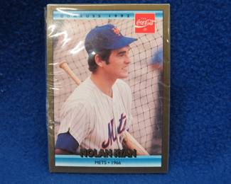 Lot 84. A wrapped package of baseball cards that only shows a 1992 Donruss Nolan Ryan 1966 Mets card and the back of a Roger W. Salkeld Rated Rookie card.