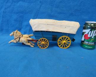 Lot 463. Cast-iron covered wagon and two-horse team. Unknown age.