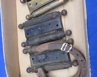 Lot 388. Three antique door hinges and three horseshoes