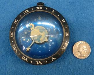Lot 469. Working Westclox Celestial clock/paperweight.