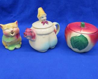Lot 53. Tom the Piper's Son teapot, Shawnee Pottery Cat creamer, and an apple dish