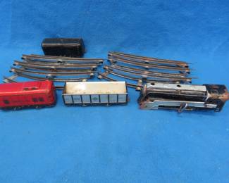 Lot 327. Hafner train set. Includes a wind-up working engine, three cars, and eight pieces of track.