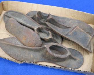 Lot 56. Five cast-iron Cobbler's shoe lasts