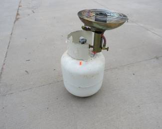Lot 152. Full 20 lb. propane tank with a heater. Old style valve