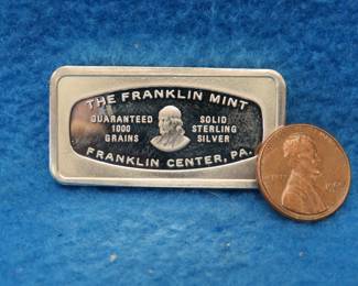 Lot 353. Franklin Mint Bank-marked sterling silver ingot. 65.44 grams.