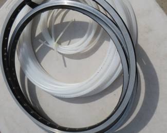 Lot 128. Three CR18 Sun bike rims and plastic tubing