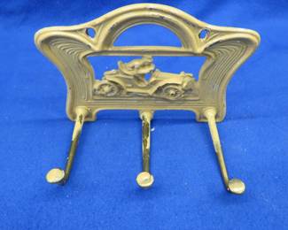 Lot 411. Vintage Judd 1620 cast iron with brass hooks racecar key hook. 7" x 5"