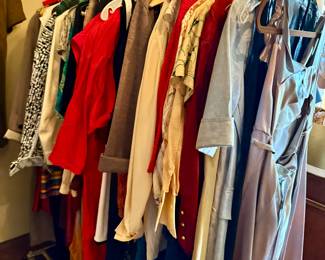 Collection of vintage and contemporary ladies clothing.