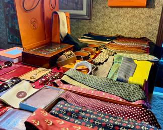 A vast collection of fine Hermes silk ties and belts . 