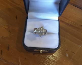 Ladies approximately 1 carat total weight Diamond cluster ring set on a 14k white gold 8mm band. Seven diamonds are prong set in a star shape. Size 6