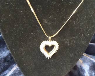 Ladies 22-in 14k yellow gold herringbone chain with diamond heart pendant. Approximate diamond weight is 1 carat total weight