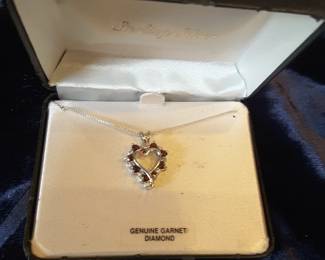 Ladies garnet and diamond necklace on sterling silver chain