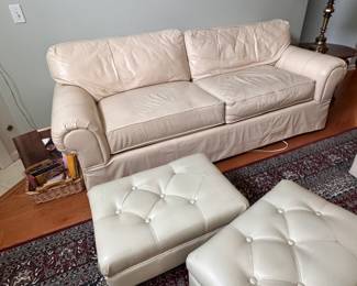 (10) Two Leather Sofas with attached back cushions and removeable seat cushions. (11) Leather Ottomans