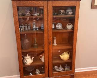 (4) Antique Oak China Cabinet with 2 glass doors, key, carved design and decorative trim. 38-1/2"w 12"d 65"h $450