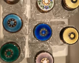 Collection of individual salts or peppers with various enamel decorated lids