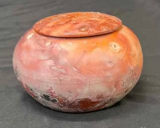 Orange Pottery Container with Lid Sparkly Exterior Pattern