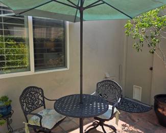 Nice heavy iron 2 chairs, table and umbrella set.