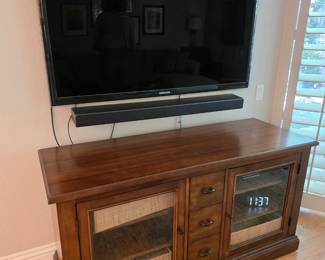Samsung smart TV 50"x30"
Sound bar
Thomasville Media cabinet. 56" wide, 30" tall
20"deep