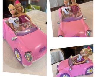 There are many Barbies for sale at this home and here you see her taking her fun car for a drive